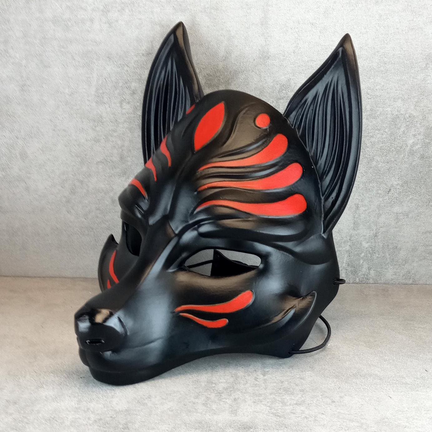 Black Kitsune (Okami) Half Mask,adorned with vivid red accents