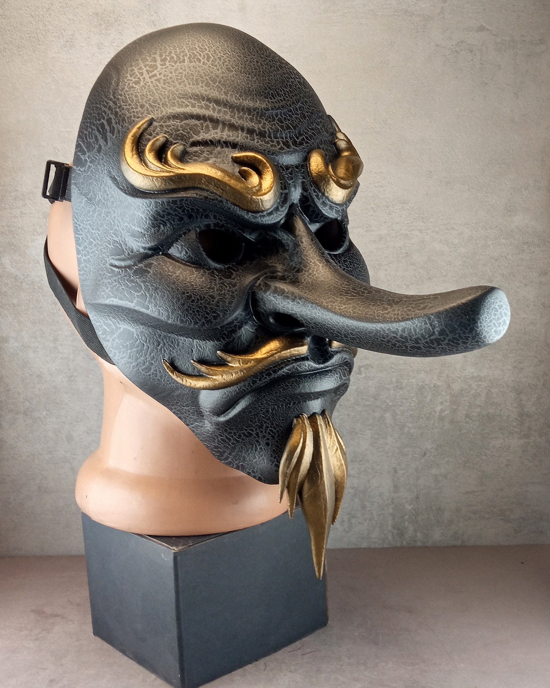 Gray cracked Tengu mask