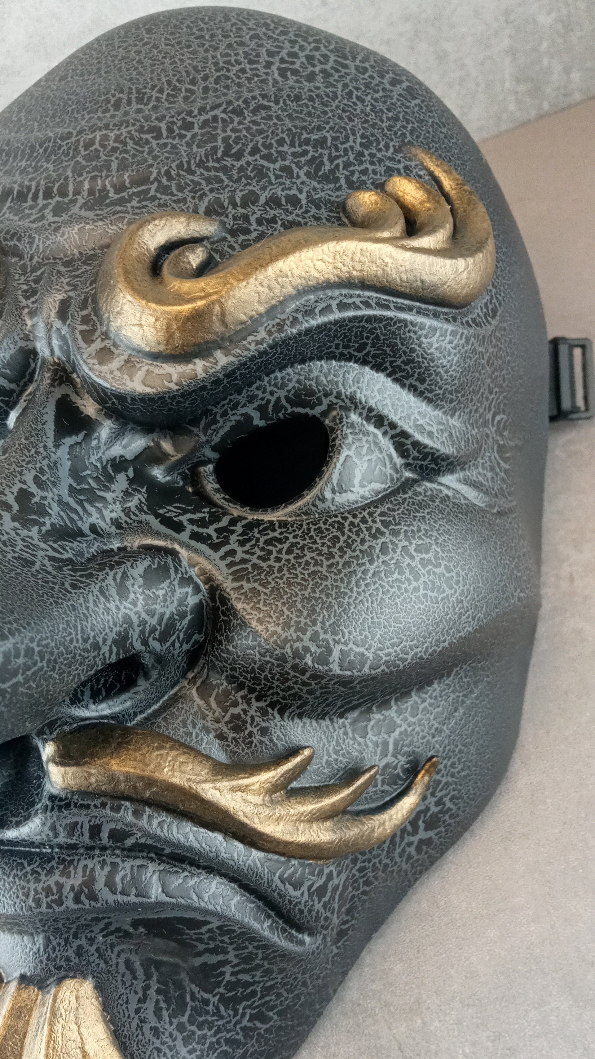 Gray cracked Tengu mask
