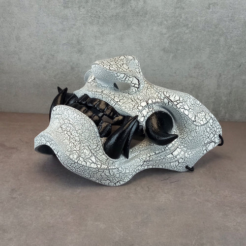 Black and white cracked samurai mask with black fangs