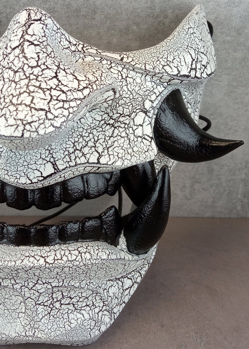 Black and white cracked samurai mask with black fangs