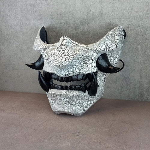 Black and white cracked samurai mask with black fangs