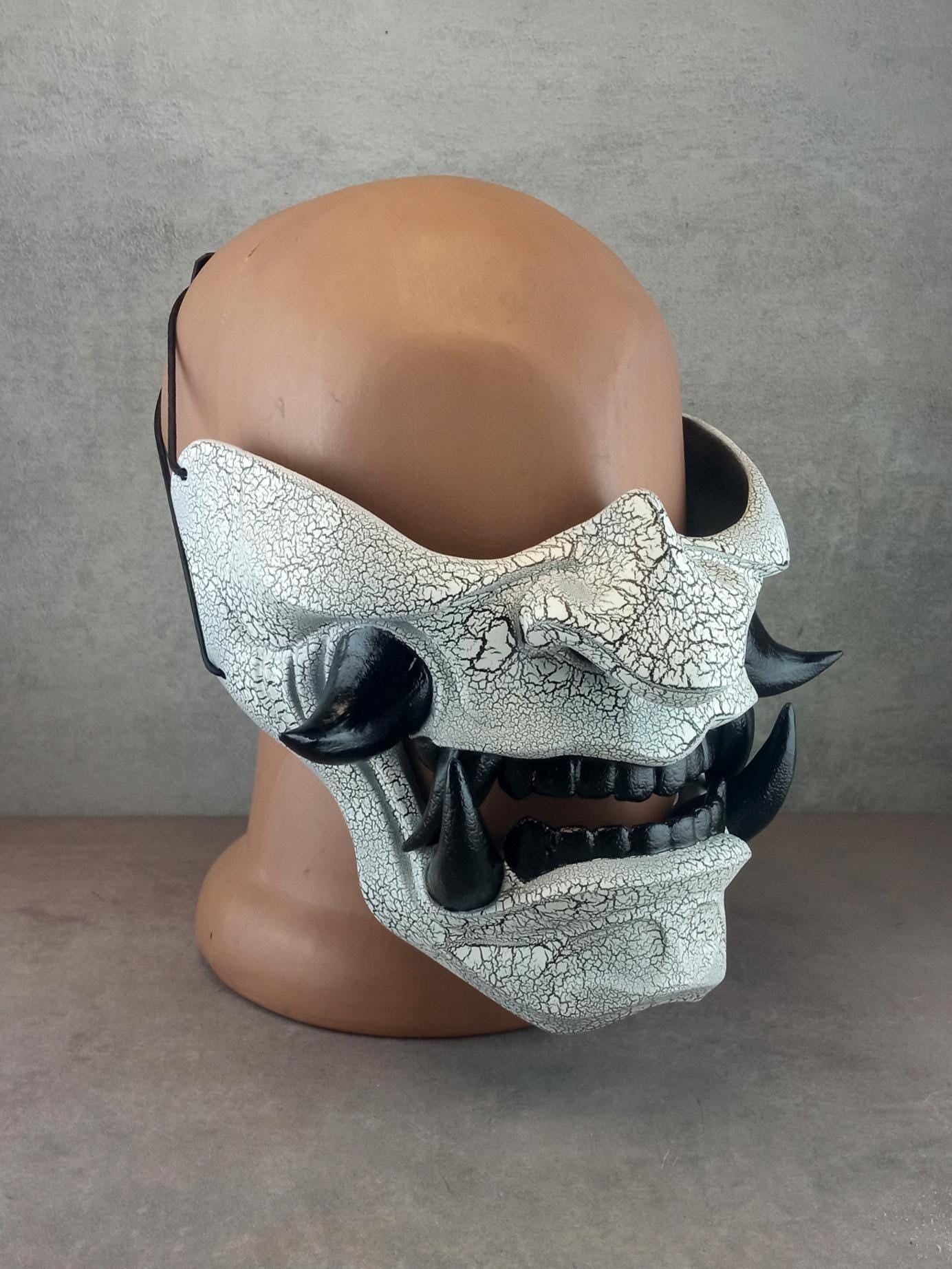 Black and white cracked samurai mask with black fangs