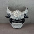 Black and white cracked samurai mask with black fangs