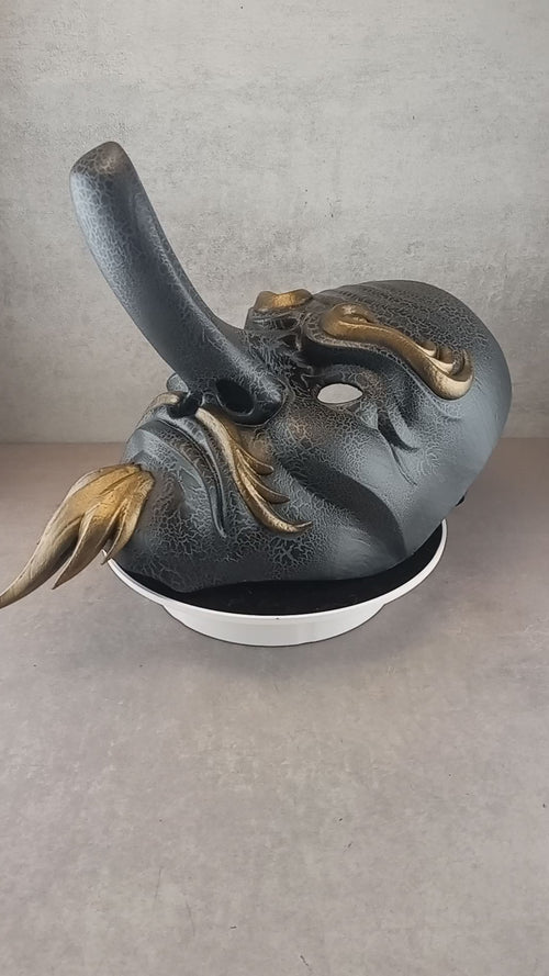 Gray cracked Tengu mask
