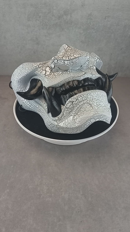 Black and white cracked samurai mask with black fangs